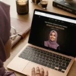 freelance digital marketer editing a website in her workspace.